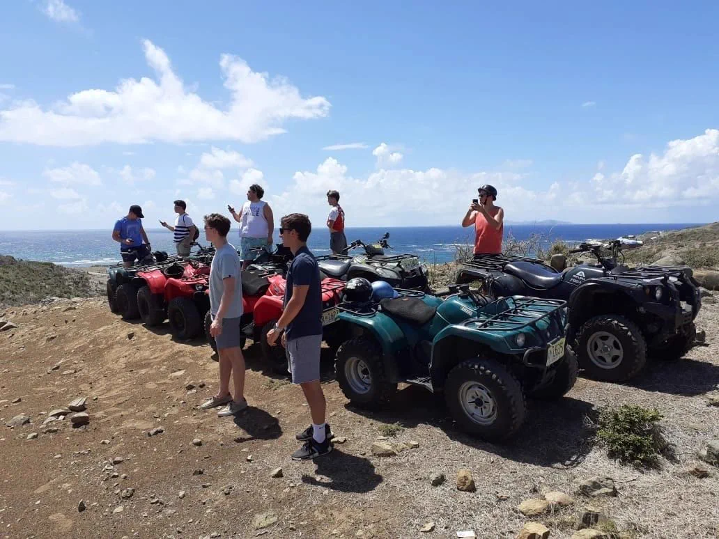 ATV Island group with quads at a panoramic viewpoint