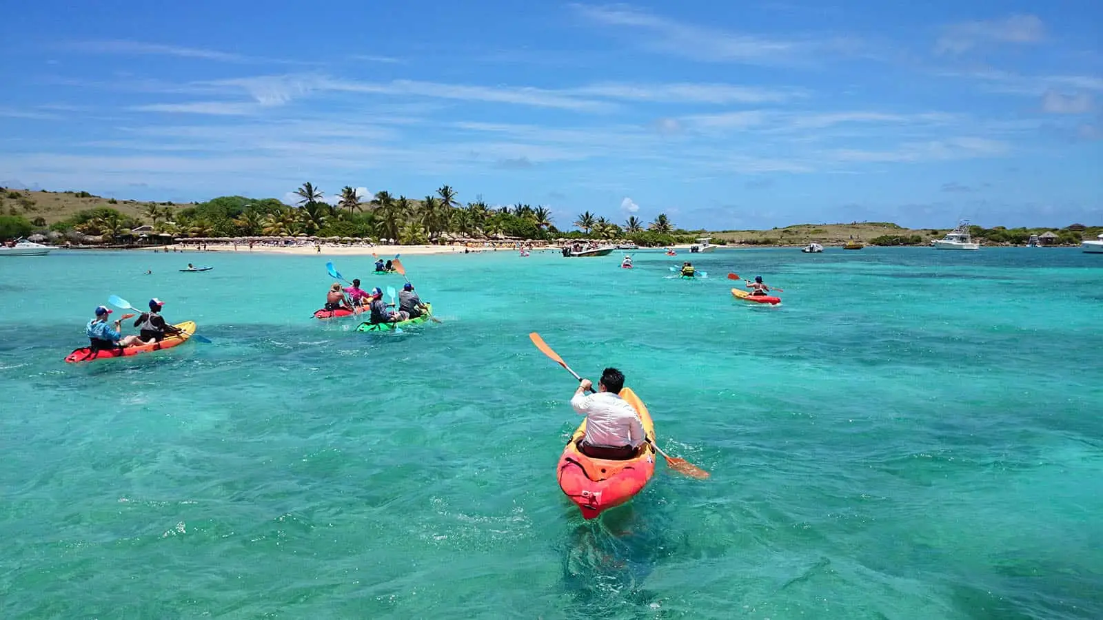 Caribbean Paddling kayaks in turquoise water between Cul-de-Sac and Pinel Island