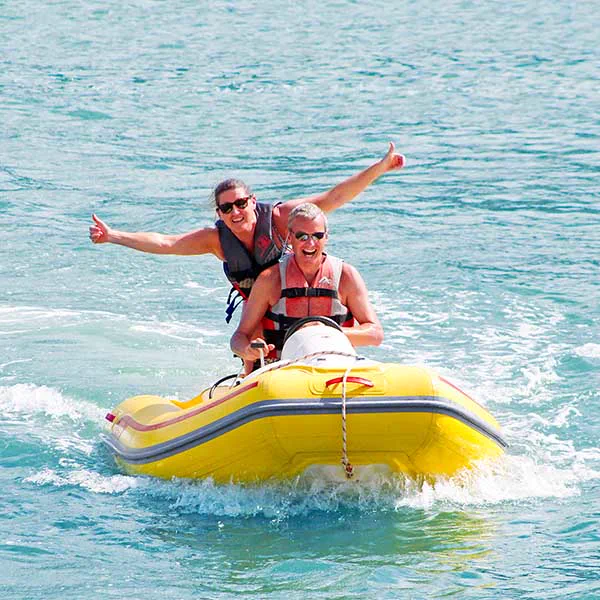 Couple driving a Rhino Rider on Saint Martin turquoise water