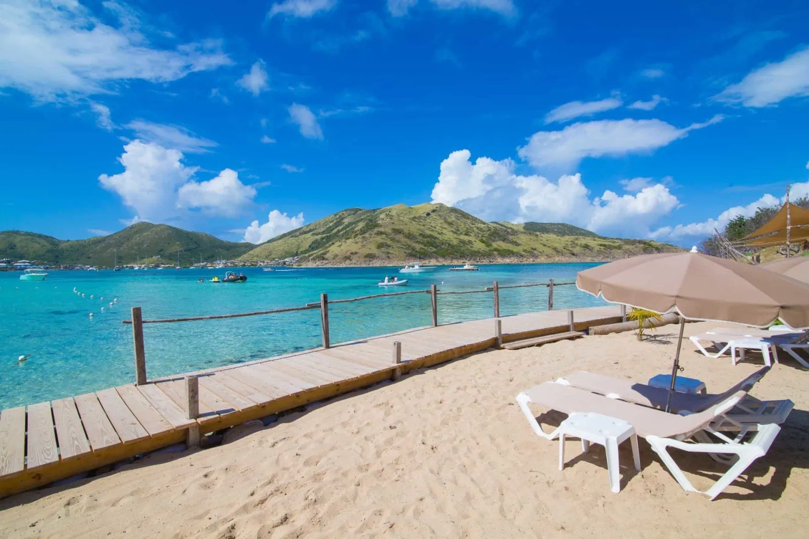 Pinel Island beach with dock and Karibuni shuttle