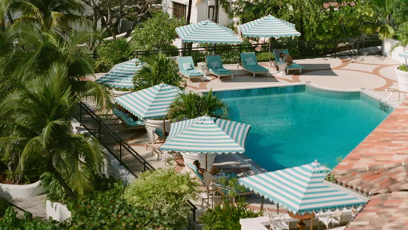 Main pool at La Samanna with blue and white umbrellas
