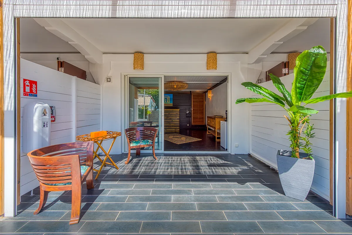 Entry patio with wooden chairs at LOVE Boutique-Hotel