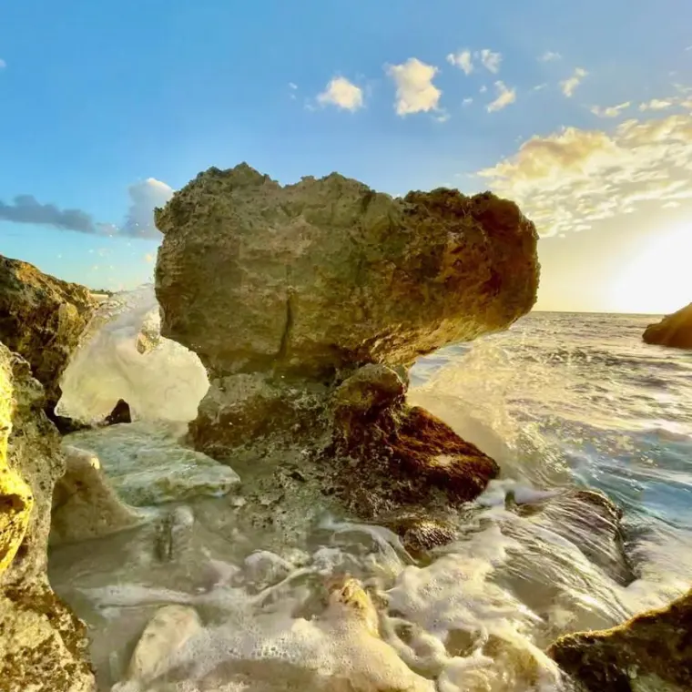Rocks and waves on the Plum Bay coast during swell