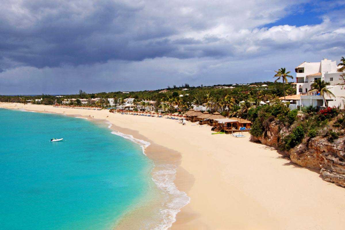Fine sand and crystal-clear waters at Baie Longue
