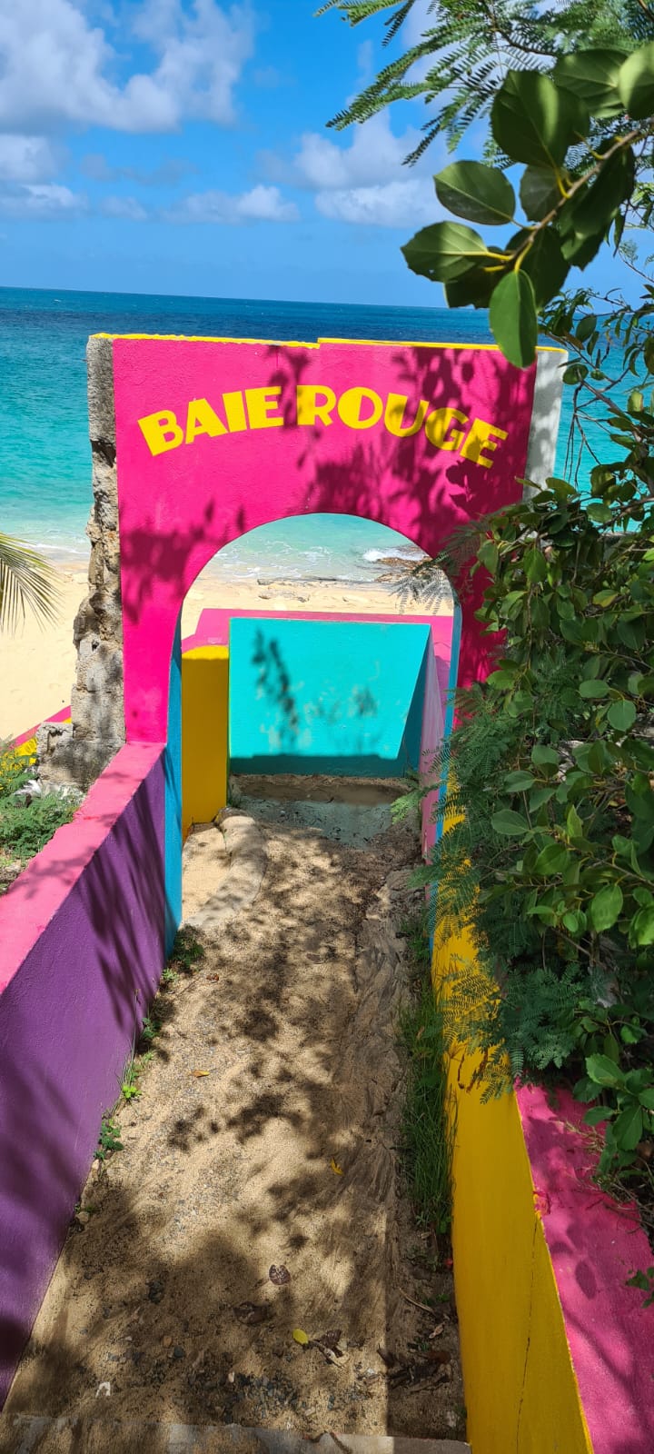 Painted staircase leading to Baie Rouge beach
