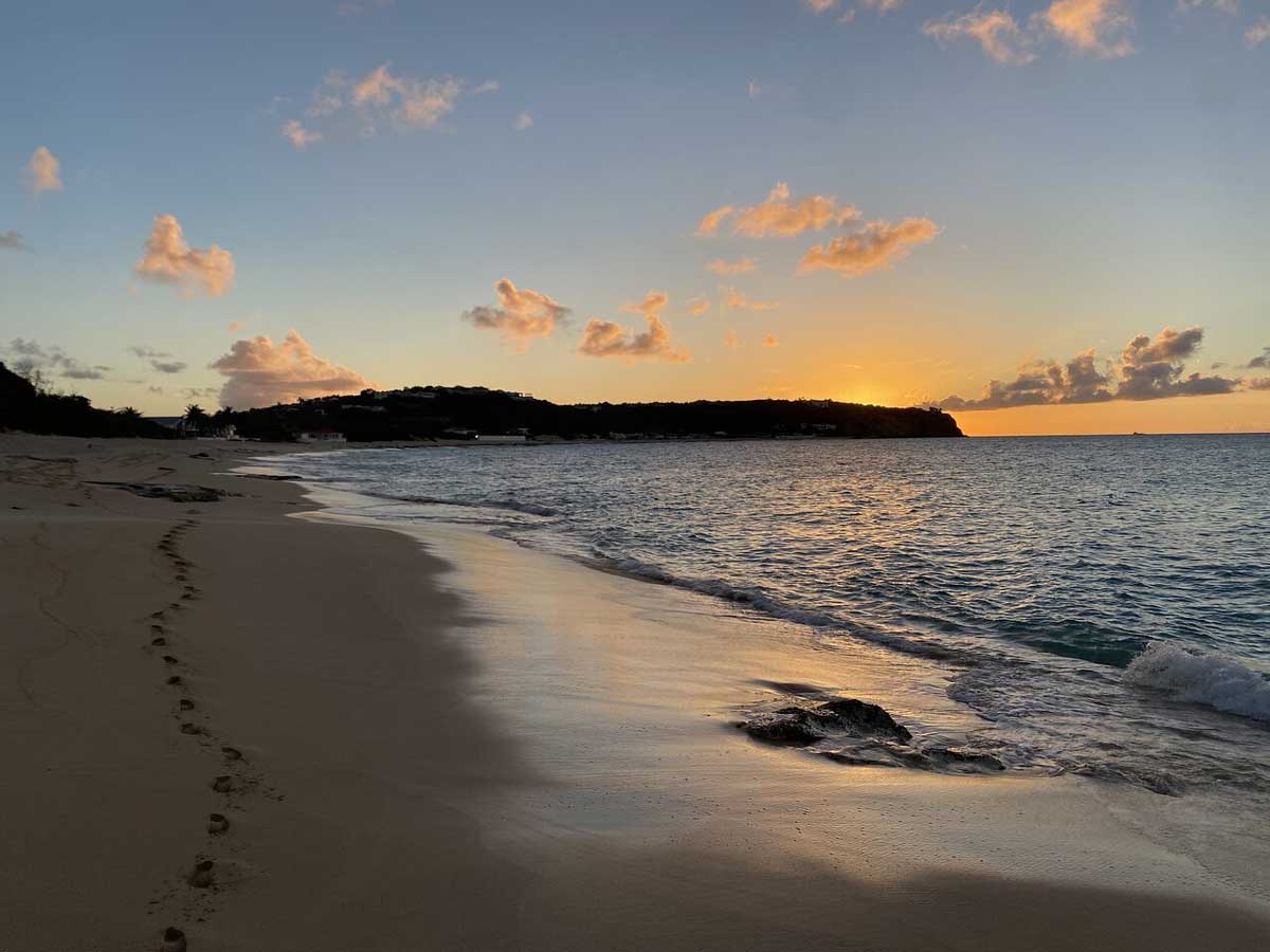 Golden sand and turquoise water at Baie Rouge
