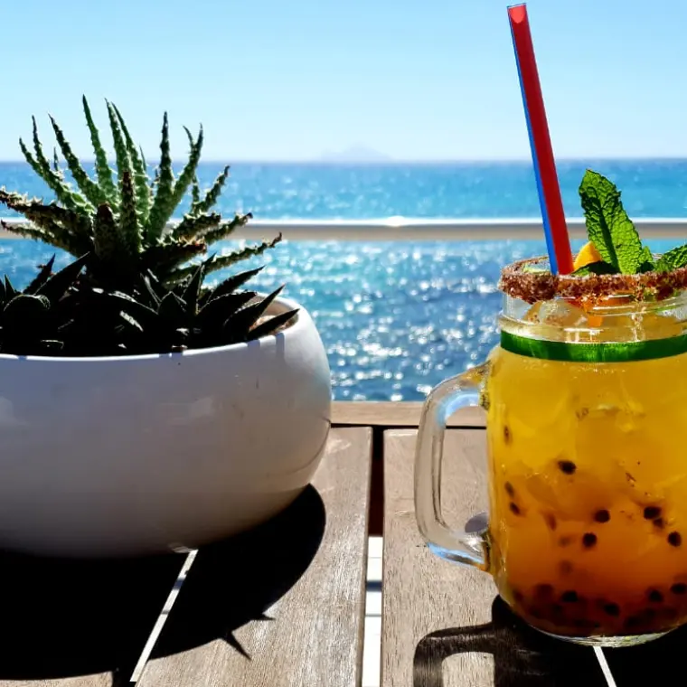 Cocktail facing the sea at Cay Bay restaurant