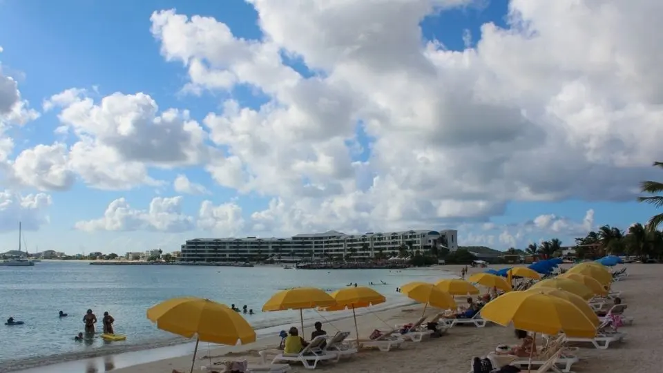 View of Kim Sha Beach with boats and Simpson Bay restaurants