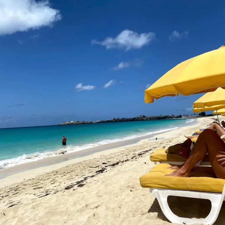 Loungers and umbrella on Kim Sha Beach near Pelican Key
