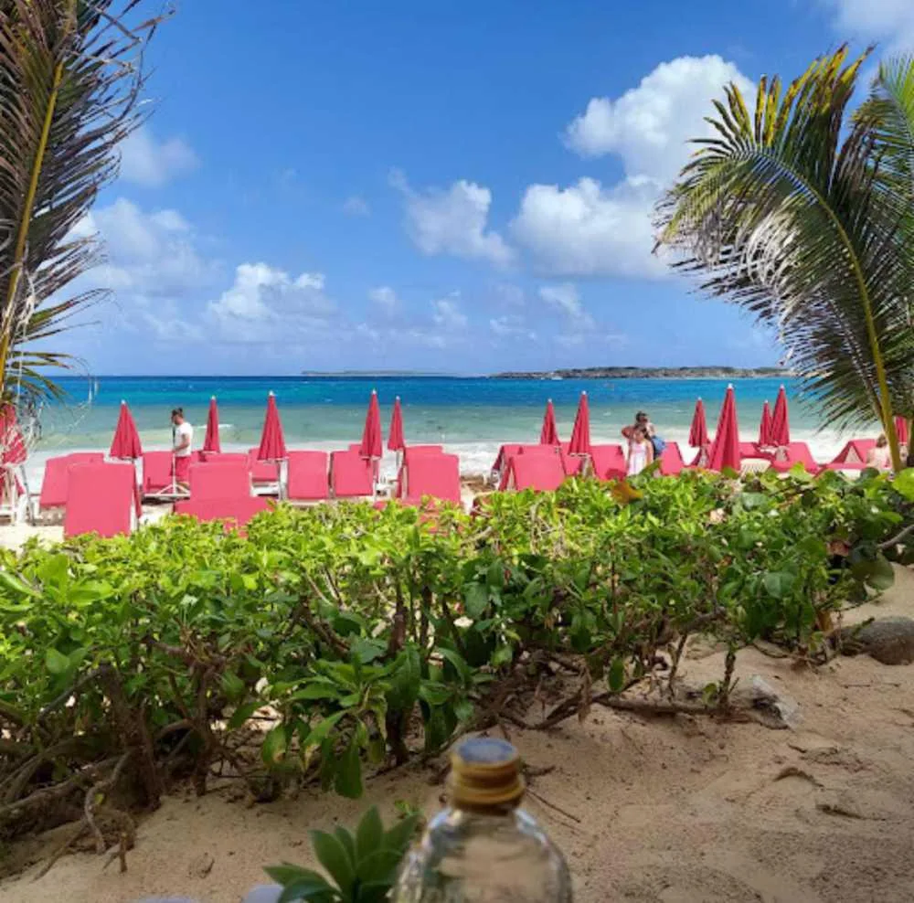 Beach clubs and sun loungers at Orient Bay