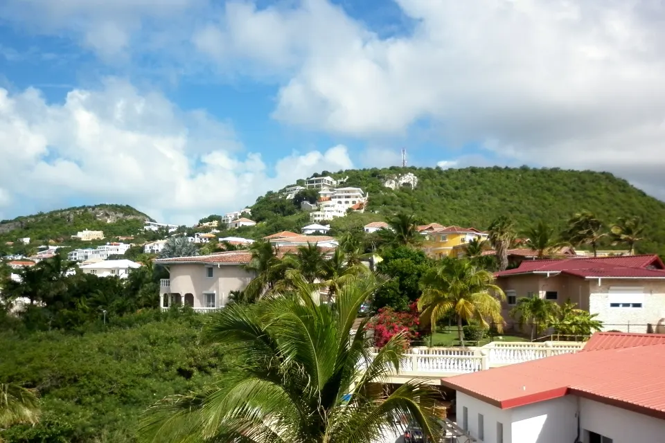 Residences and hills above Pelican Key Beach in Sint Maarten
