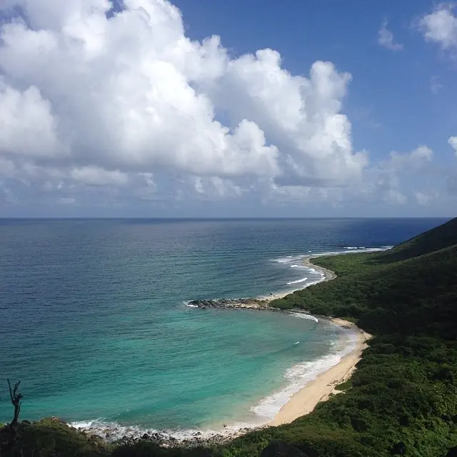 Panoramic view over Petites Cayes bay from the trail