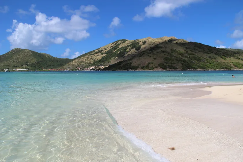 Crystal-clear water and white sand on the main beach of Pinel Island facing Cul-de-Sac