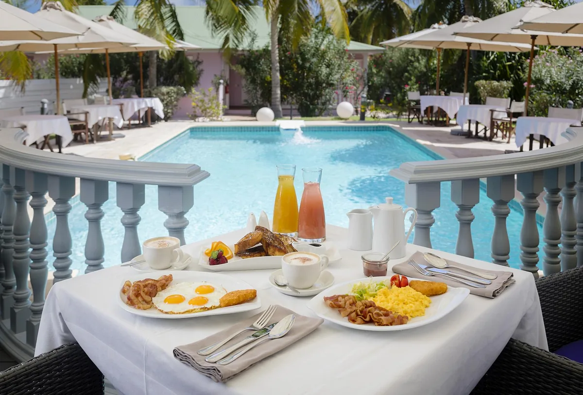 Breakfast served by the Esmeralda Resort pool at L'Astrolabe