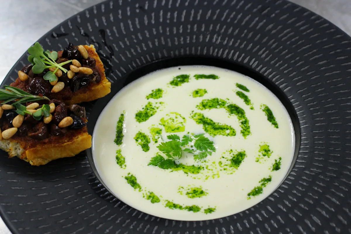 Cauliflower velouté, mushroom crouton and herb oil starter at L'Astrolabe