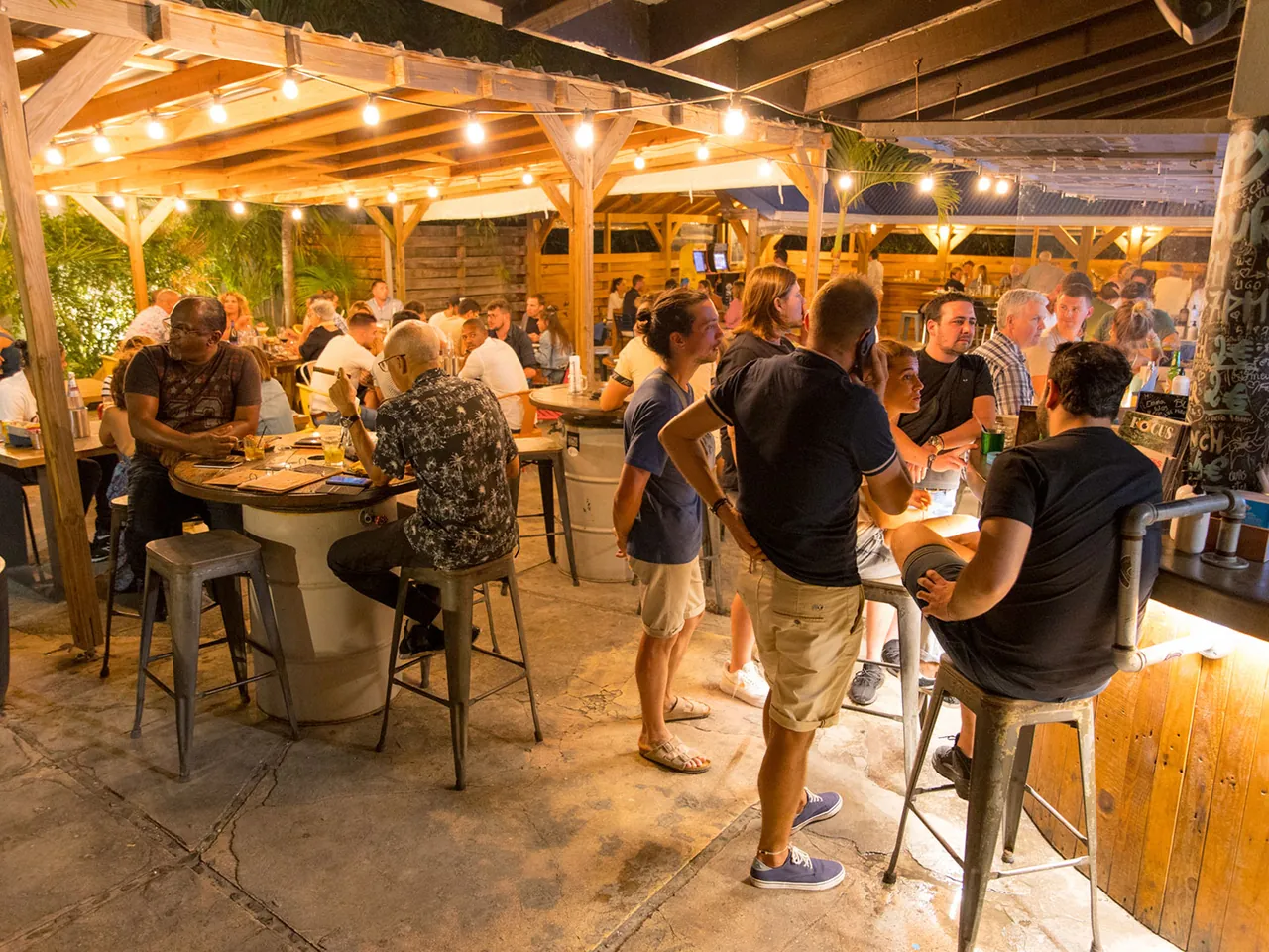 Outdoor terrace of Blue Martini in Grand Case with set tables and string lights