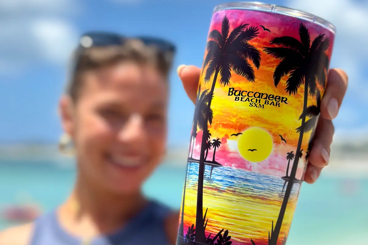 Buccaneer Beach Bar signature glass with a beach view