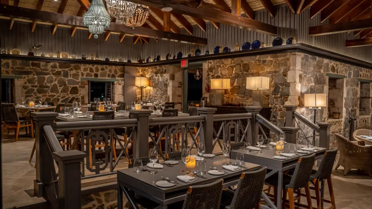 Emilio's - Historic dining room with stone walls and set tables at Rockland Estate