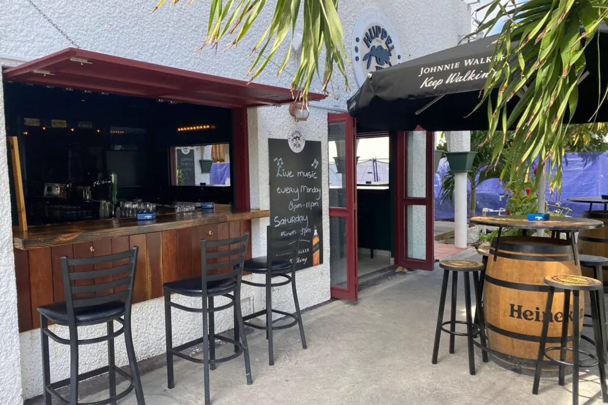 Entrance and terrace of Huppel The Pub on Welfare Road in Simpson Bay