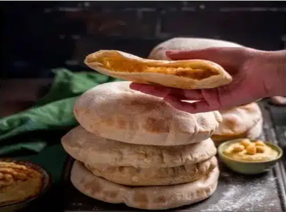 Pitas served with spread in the Greek cuisine of Kalos