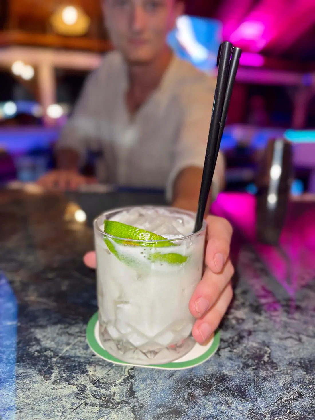 Kraken Raw Bar SXM - cocktail served at the bar in a colorful atmosphere