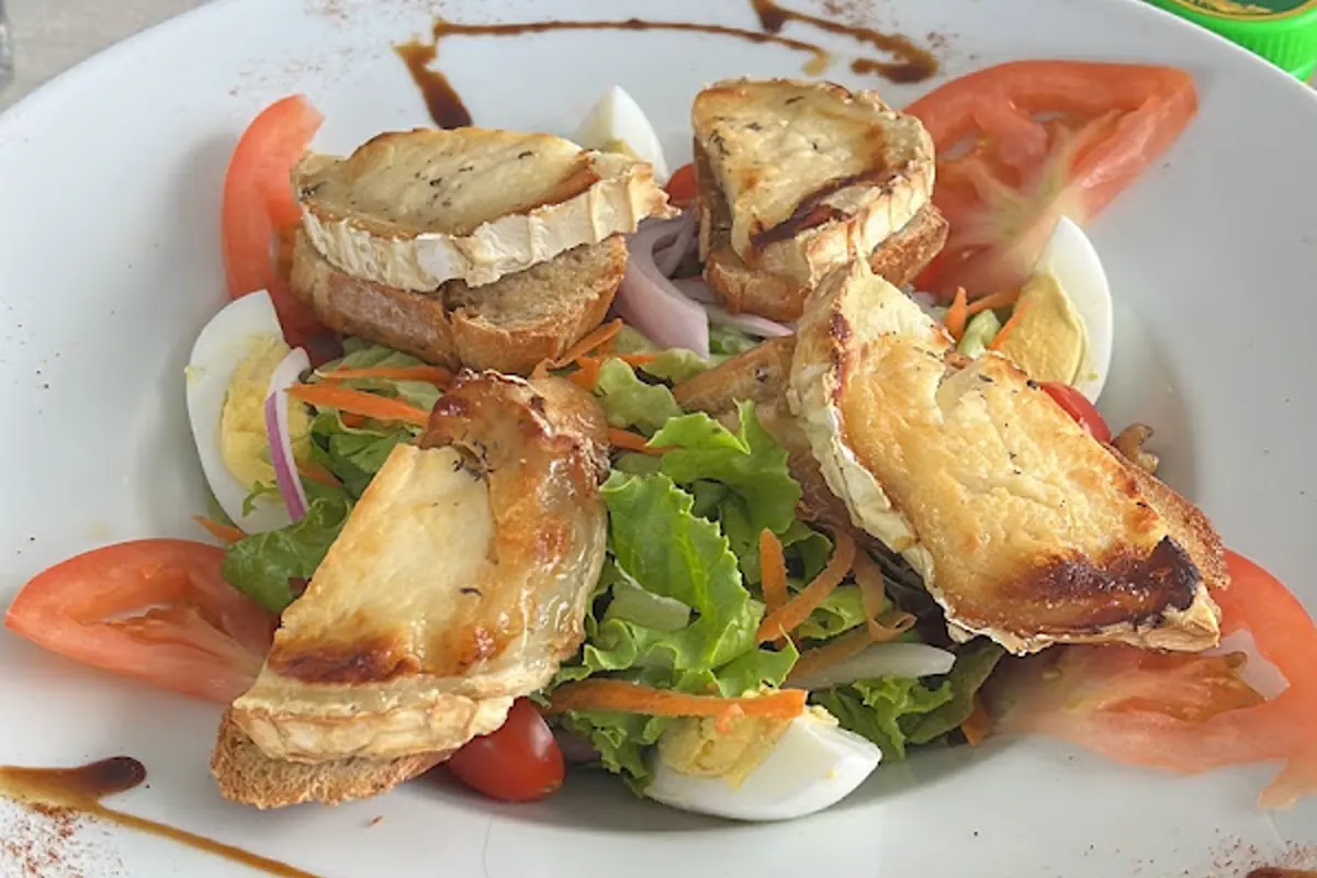 Warm goat cheese salad served at Le Grand St Martin in Marigot