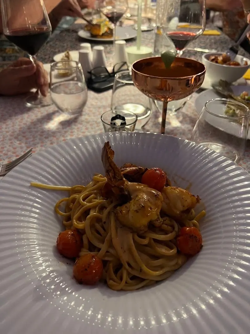 Linguine served at the table with a cocktail at Le Sud restaurant