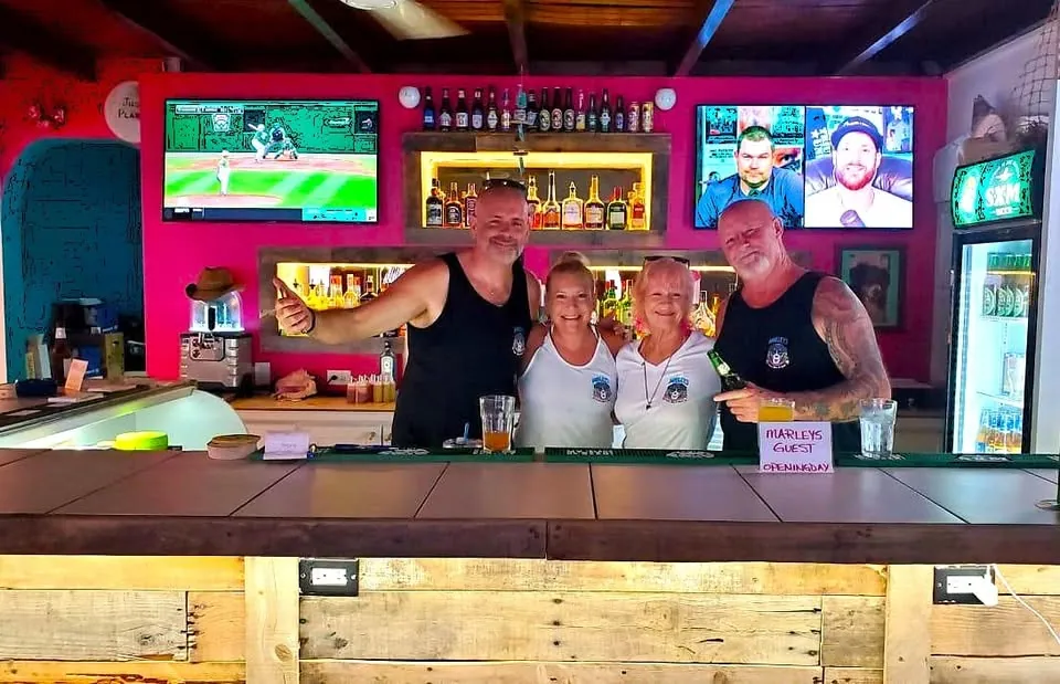 Marley's Sports Bar & Grill - indoor bar with sports screens and staff behind the counter