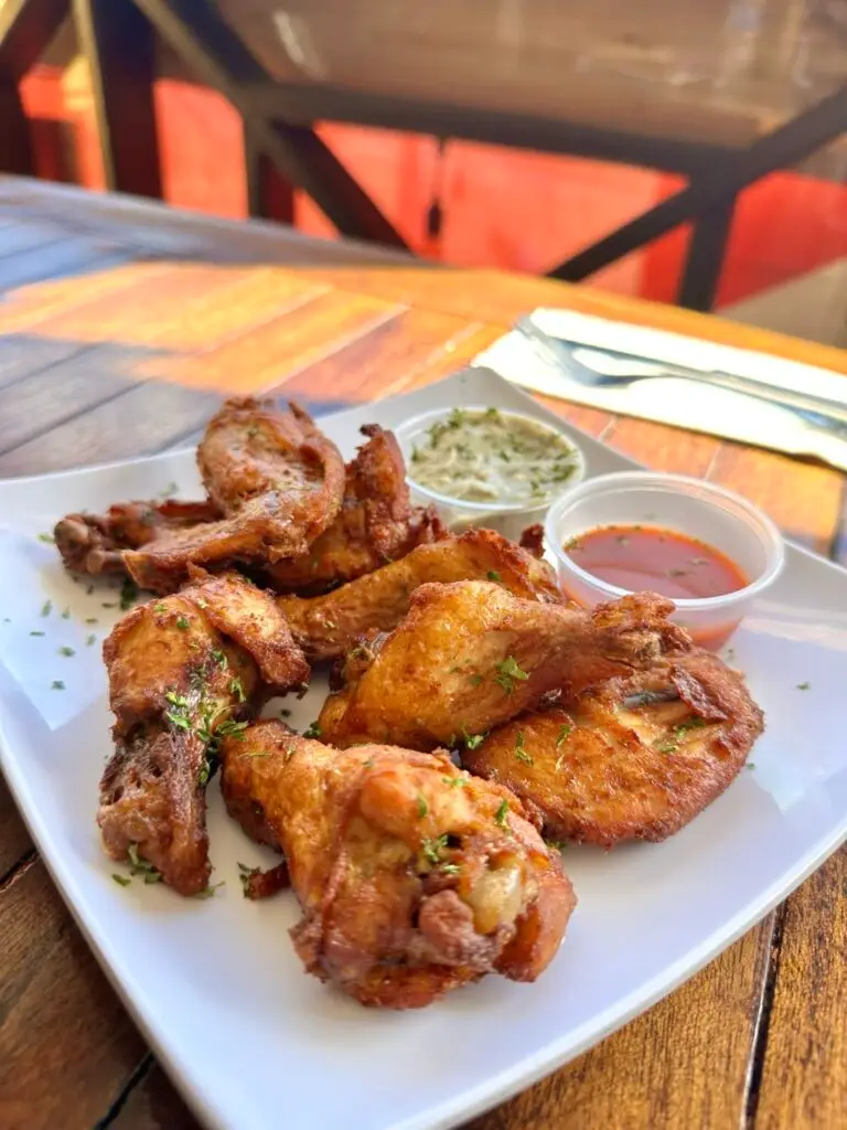 Mary's Boon - plate of crispy wings served at the Caribbean bar