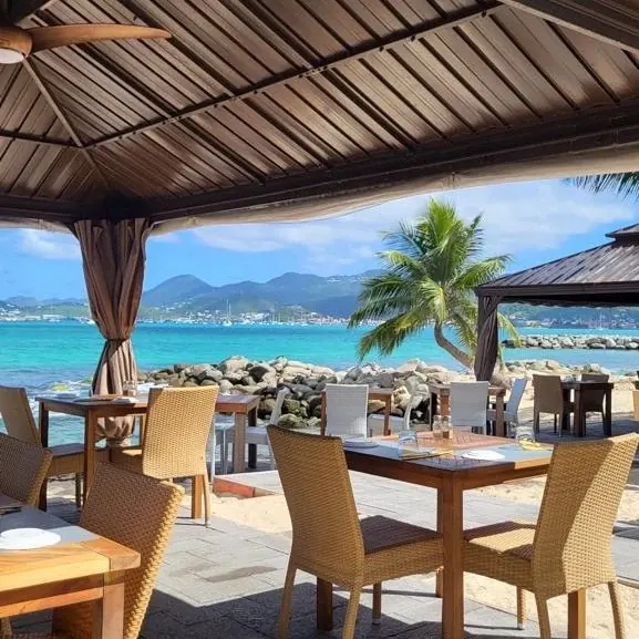 Outdoor terrace of Mezza Luna facing the sea in Nettle Bay