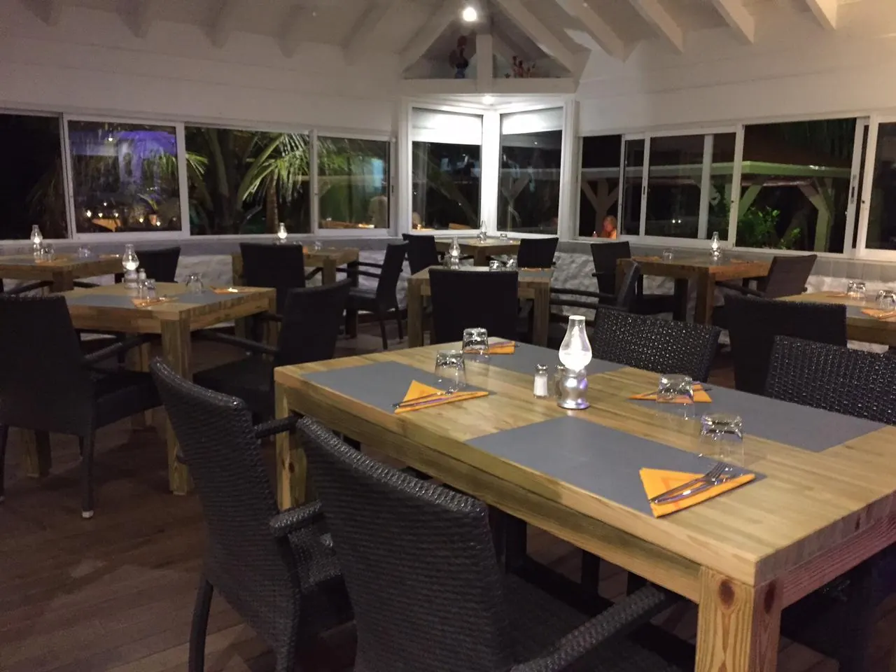 Mezza Luna indoor dining room with wooden tables and large windows