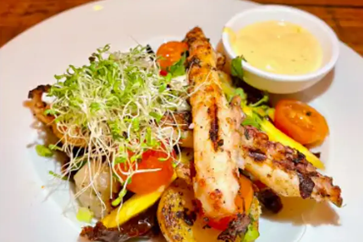 Grilled fish and salad served at Nowhere Special in Simpson Bay