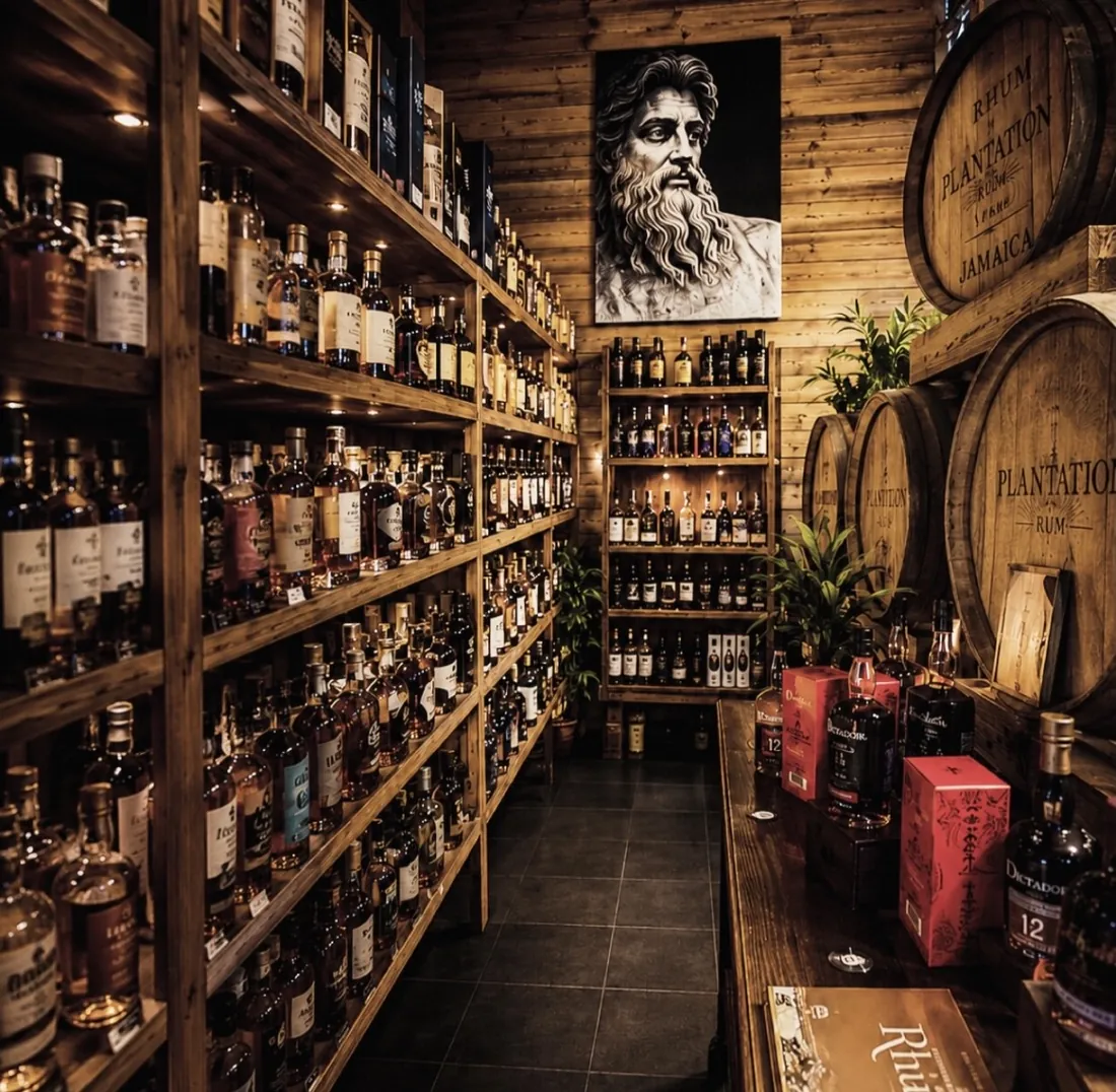 Oualichi Rhum - Shop aisle lined with rum bottles