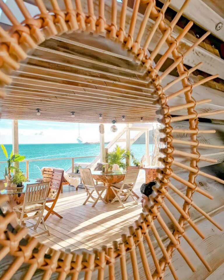 Rainbow Cafe - Beach terrace with loungers and umbrellas