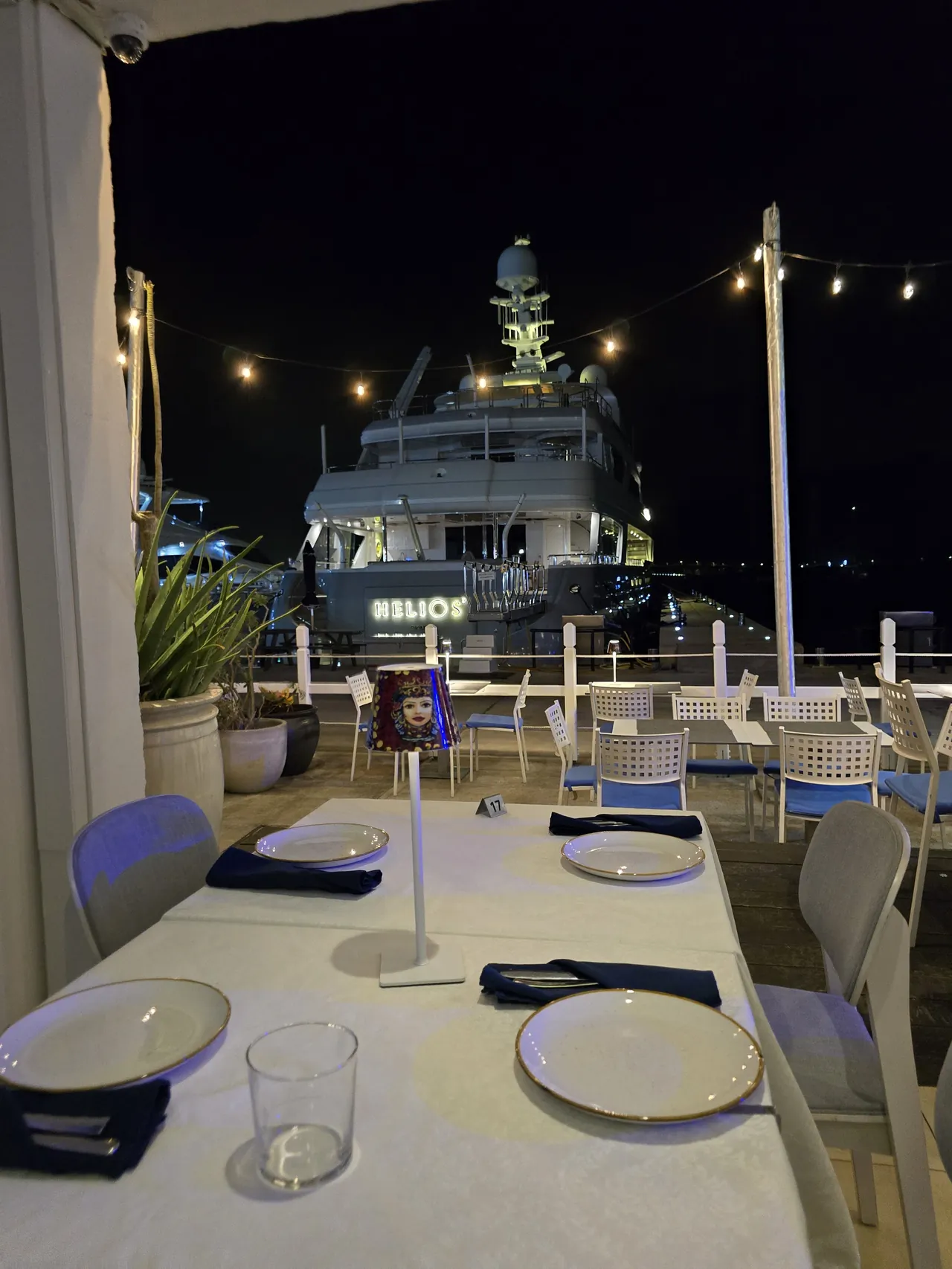 Set table on the Sale & Pepe marina terrace with yachts in the background