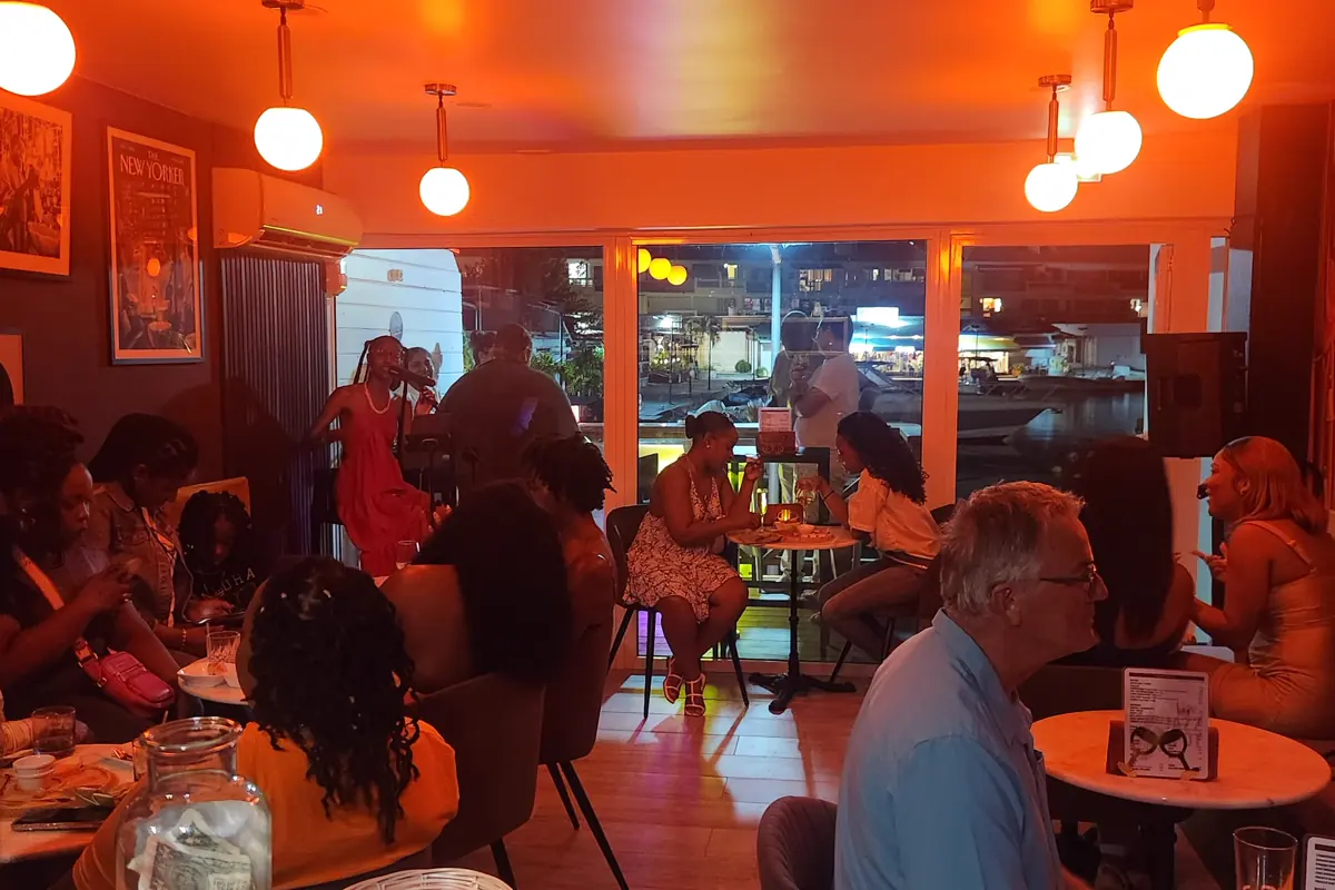 Intimate room at The Jazz Spot with live music and tables at Marina Royale