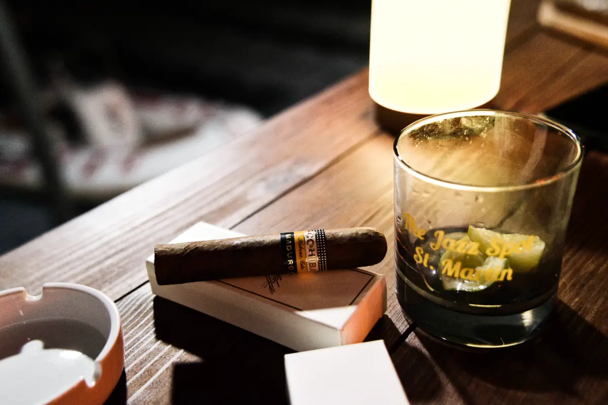 Cocktail and cigar in The Jazz Spot speakeasy atmosphere