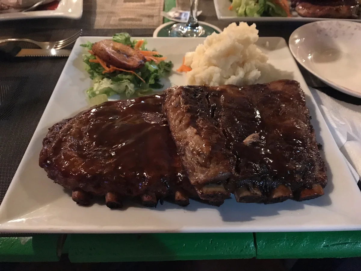 Glazed Drunken Ribs, signature dish of The Palms in Simpson Bay