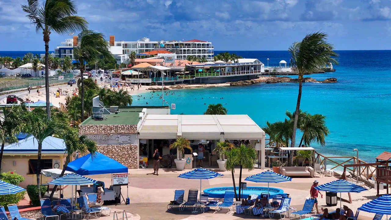 Tortuga Maho - Terrace, beach beds and Caribbean Sea at Maho Beach