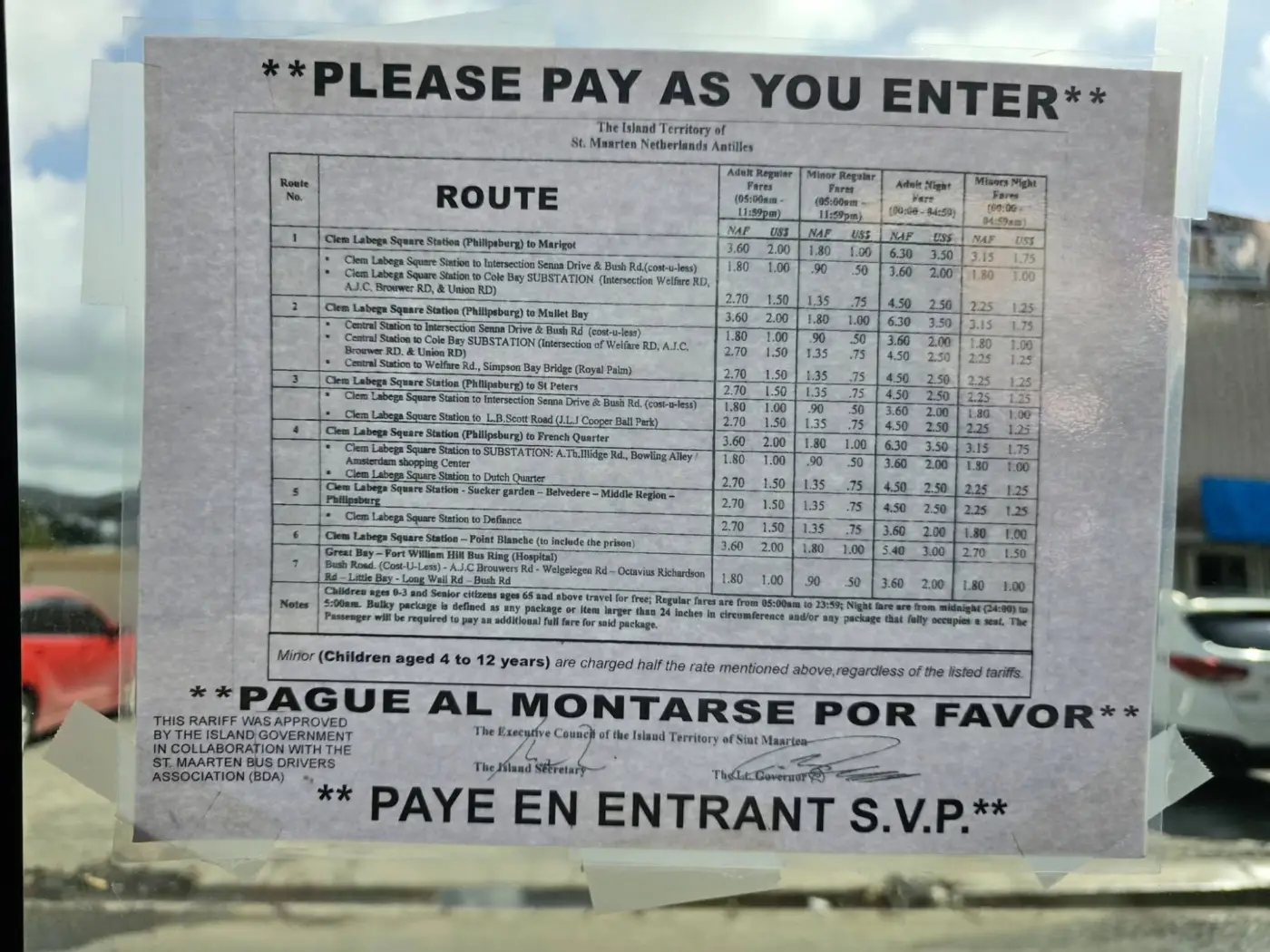 The official fare chart posted in a Dutch-side bus