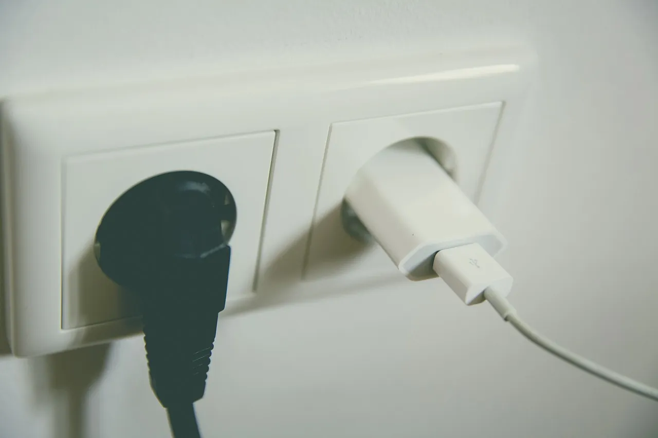 European double wall outlet with a plug and a charger, as used on the French side
