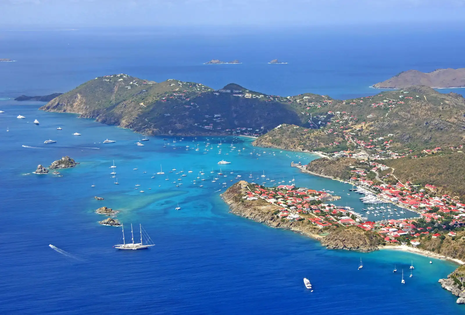 Aerial view of Gustavia, its harbor and anchored sailboats in St. Barths
