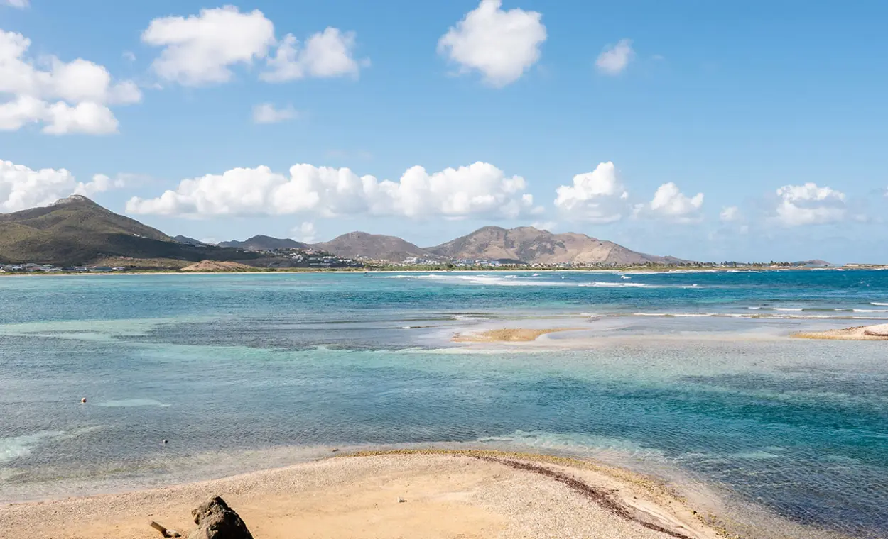 Panorama of Lucas Bay with turquoise water, reef and Saint Martin east coast