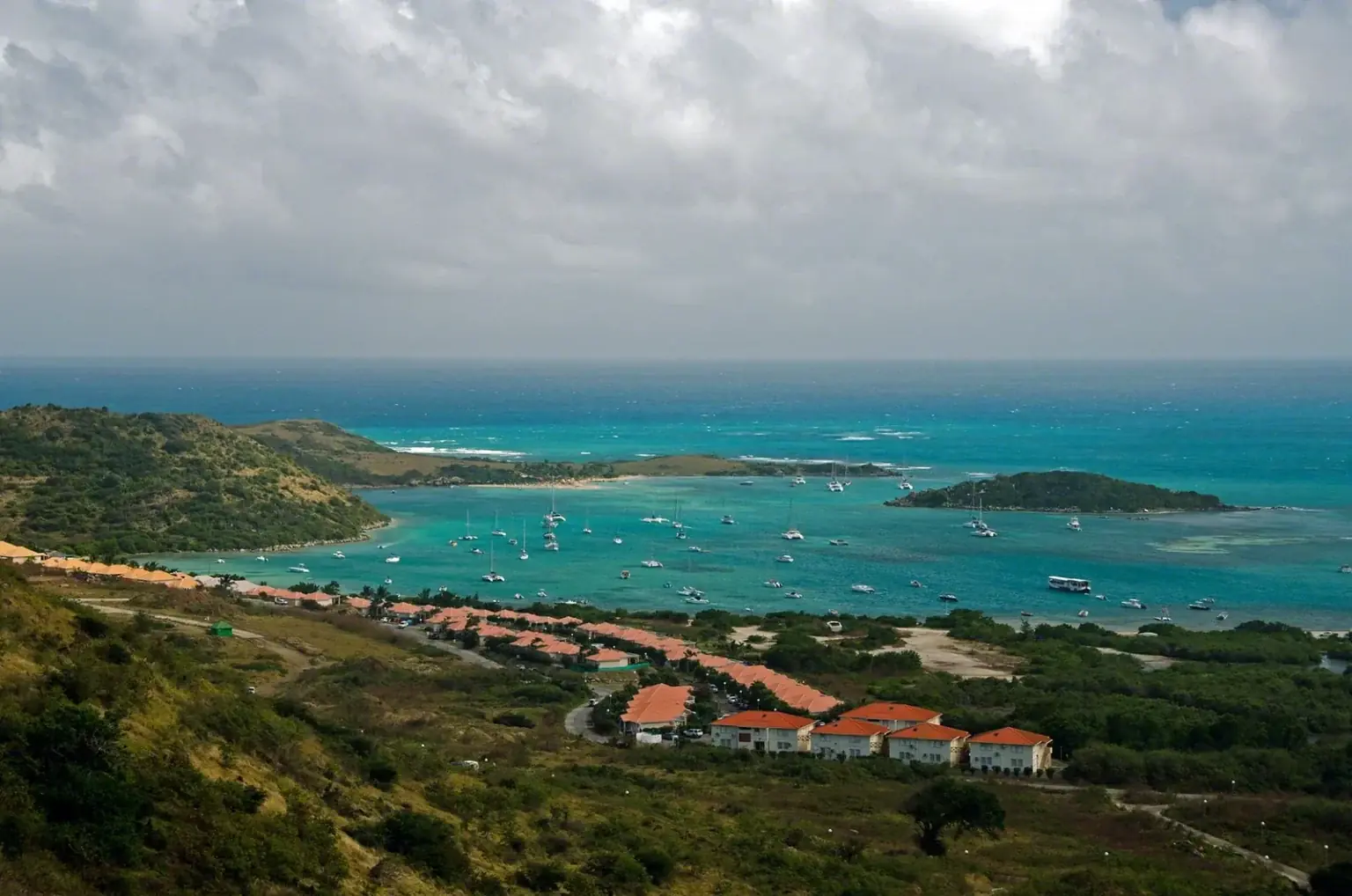 Aerial view of Cul-de-Sac and Pinel Island with sailboats at anchor and turquoise water