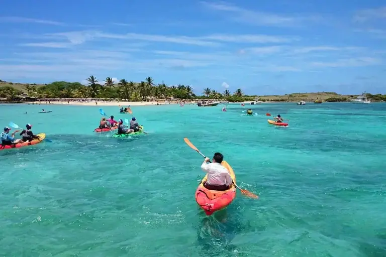Caribbean Paddling kayaks in turquoise water between Cul-de-Sac and Pinel Island