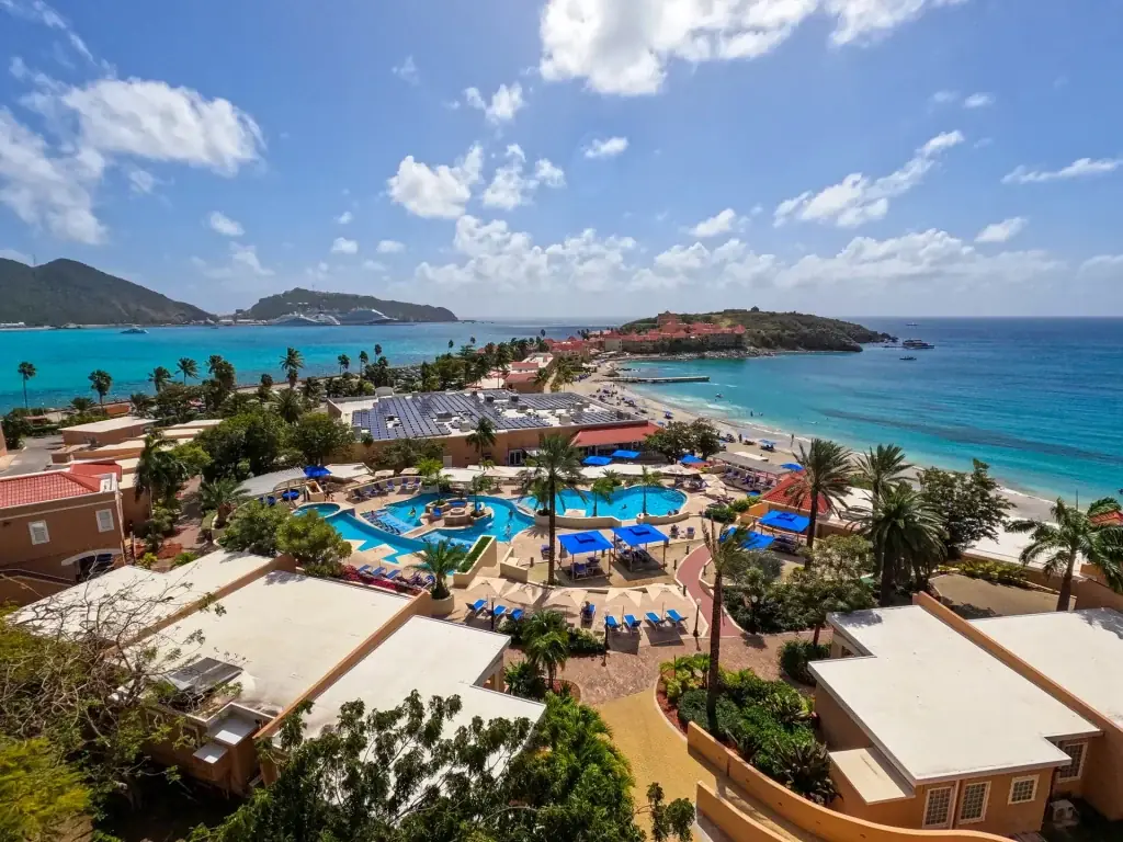 Aerial view of Divi Little Bay Beach Resort, its pools and its peninsula