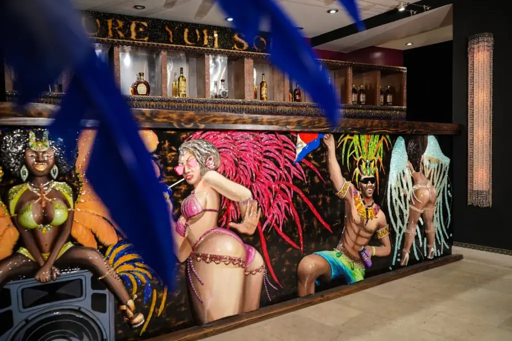 The We Culture museum bar, decorated with Carnival figures in relief