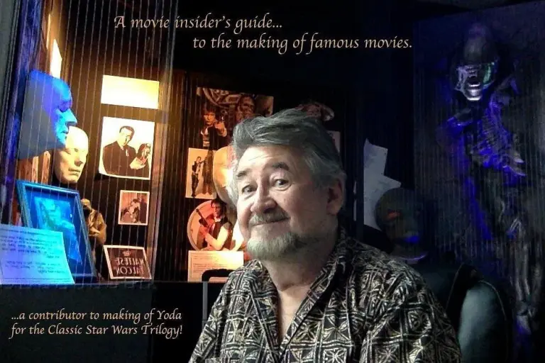 Nick Maley in front of face casts and behind-the-scenes photos